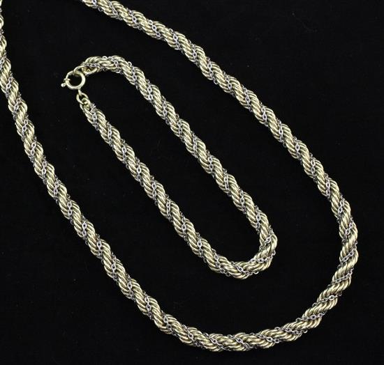 A 14ct gold and white metal rope twist necklace and matching bracelet, necklace 30.5in.